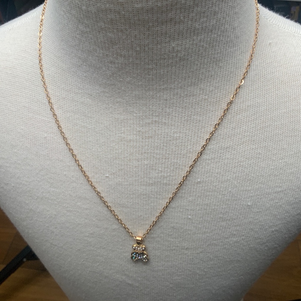 Gold-toned necklace with pearl and rhinestone teddy bear charm